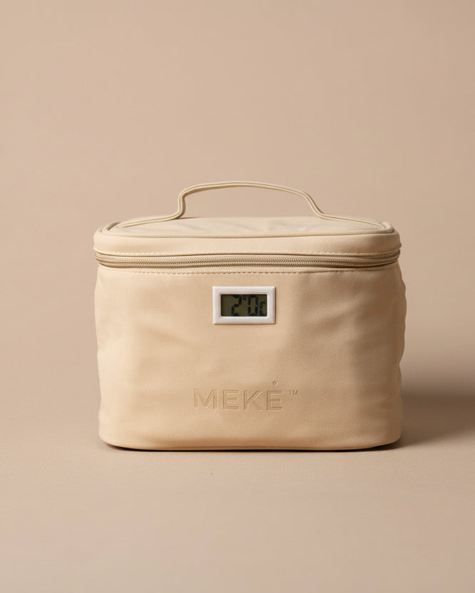 A beige insulated zippered case with a top handle and a small front digital temperature display, photographed on a plain beige studio background. The brand name MEKE is embossed on the front.