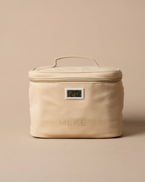 A beige insulated zippered case with a top handle and a small front digital temperature display, photographed on a plain beige studio background. The brand name MEKE is embossed on the front.